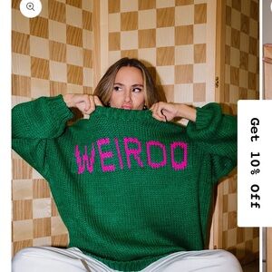 Dressed in LALA Green Sweater with Pink Graphic